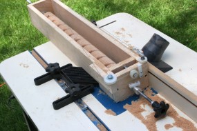 Hastily Created Jig For Routing Spiral Trim Patterns. The Wood Blank Rotates as the Jig Slides Along Fence