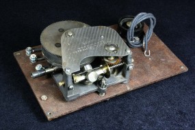 A Spring Powered Phonograph Motor Drives the Reels